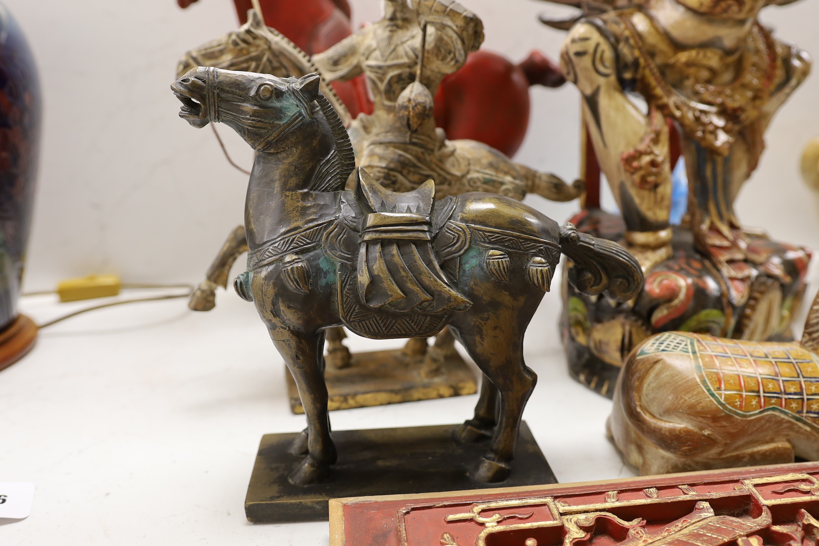 A quantity of south East Asian wood carvings including Chinese wood panels and an Indonesian carving of Garuda 80cm